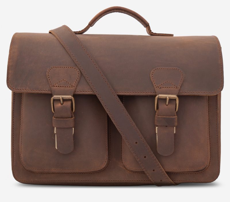 Front view of the brown leather professor satchel with shoulder belt.