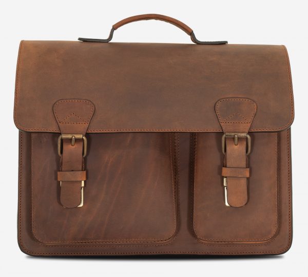 Front view of brown leather satchel briefcase with asymmetric front pockets.