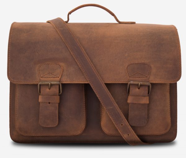 Front view of large brown leather satchel briefcase with a leather shoulder strap.
