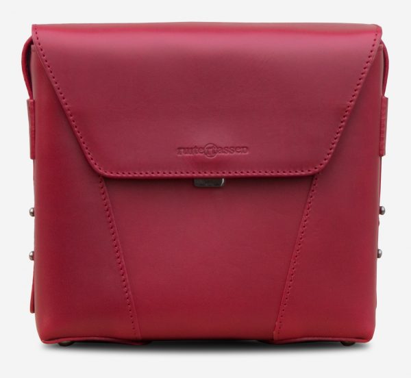 Front view of the small red vegetable-tanned leather crossbody bag for women.
